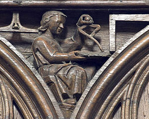 Poitiers choir stalls, spandrel 20 - an architect with his tools
